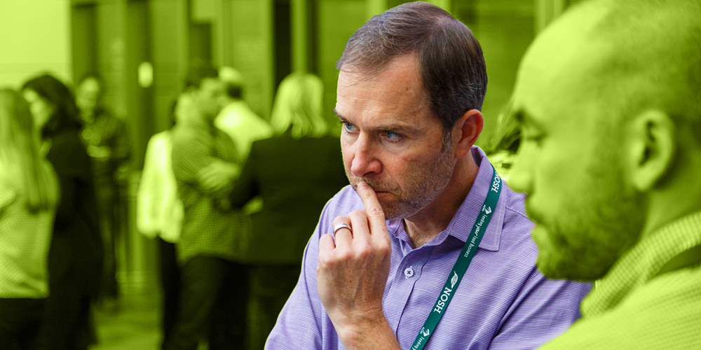 man considers low EventNut pricing for event check-in software and tools
